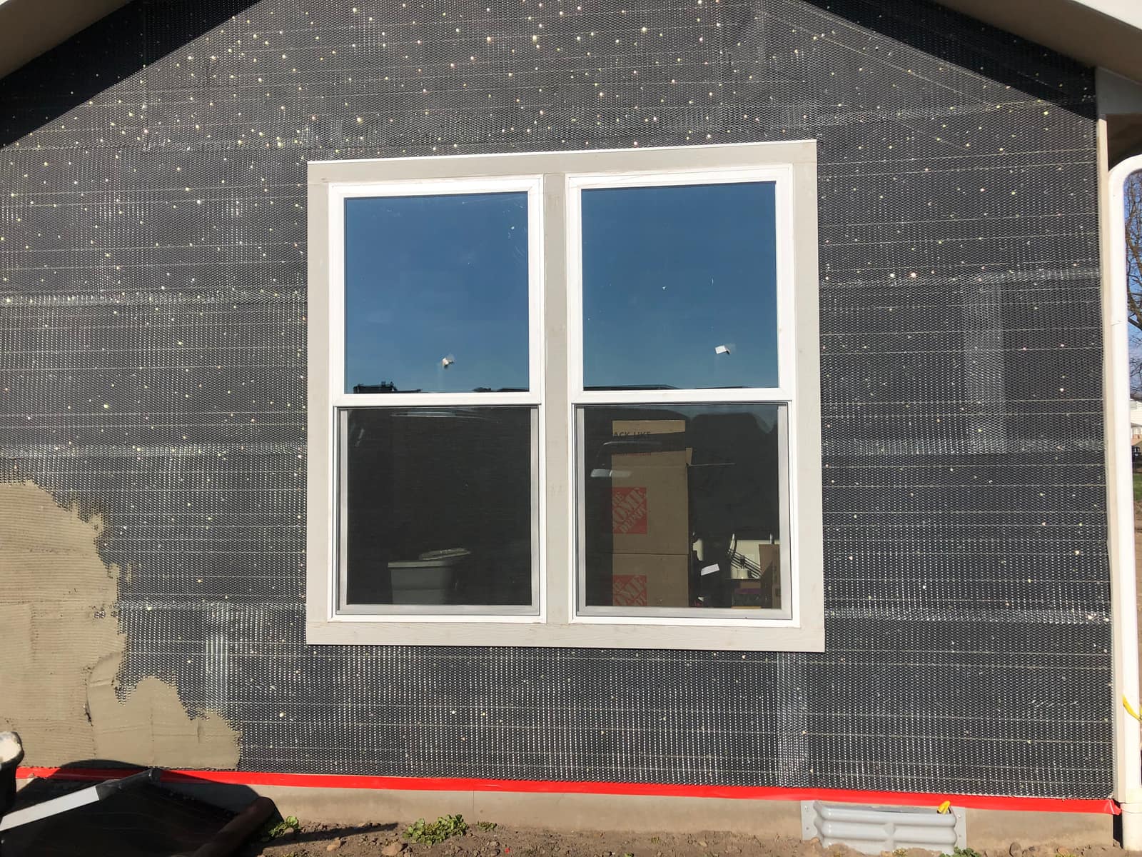 Same gable wall in lath and scratch coat before stone veneer