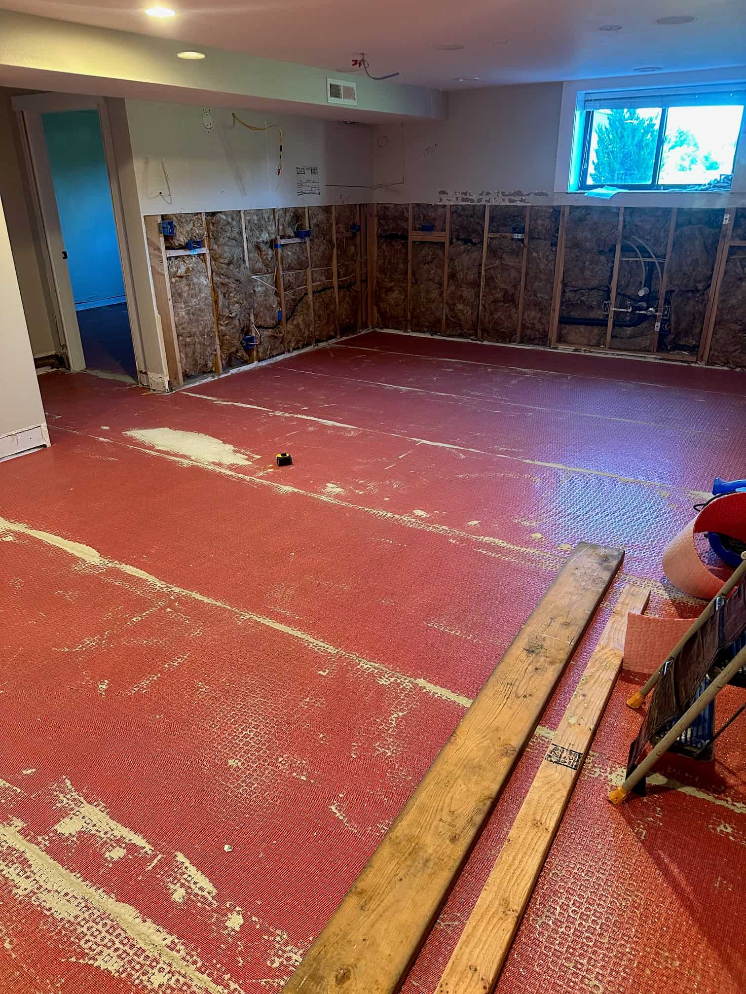 Basement stripped to the subfloor during renovation