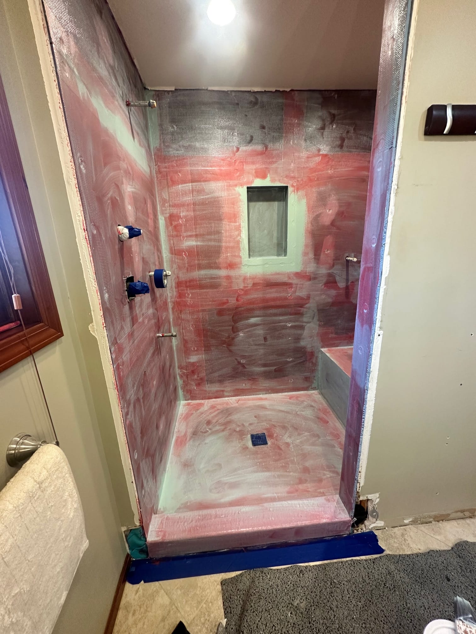 Shower walls waterproofed before tile installation