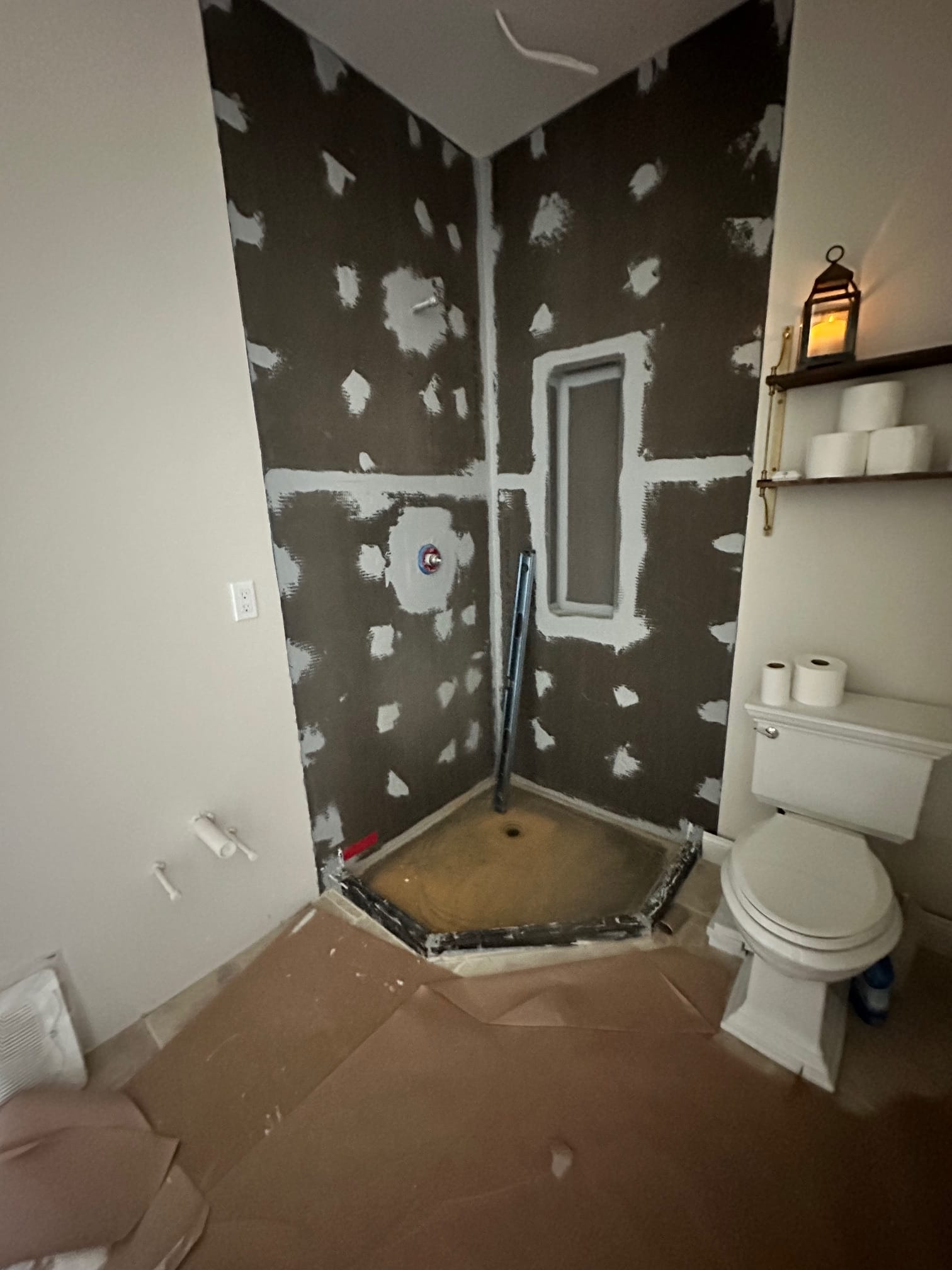 Corner shower waterproofed and ready for tile